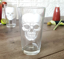 Load image into Gallery viewer, Egads Shop clear 16 ounce tumbler pint drinking glass with white screen print image of skull.